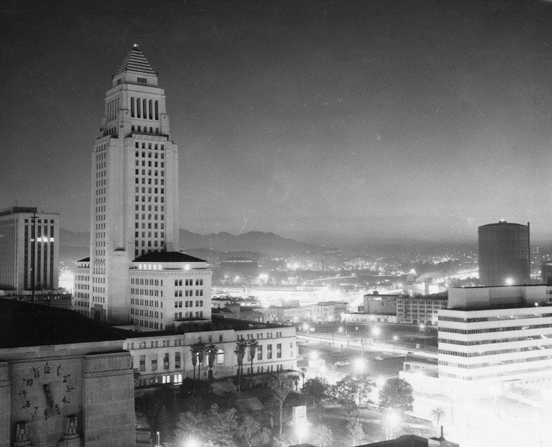 An atomic bomb from the Nevada tests lights up the sky in this photograph taken on March 1, 1955 from the Mirror Building of the Los Angeles Times.